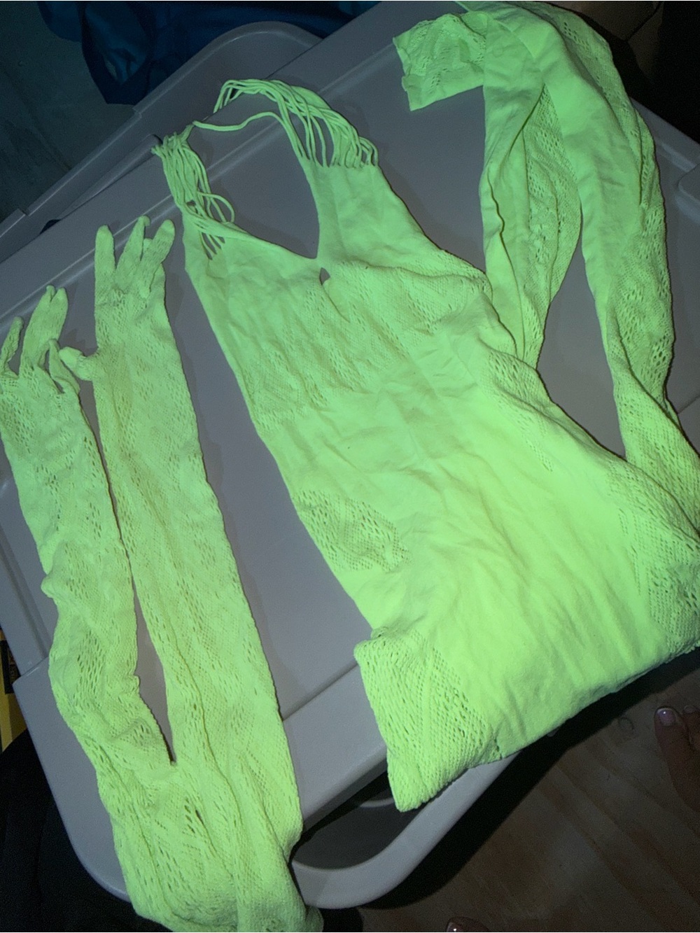 Neon green mesh jumpsuit with matching gloves